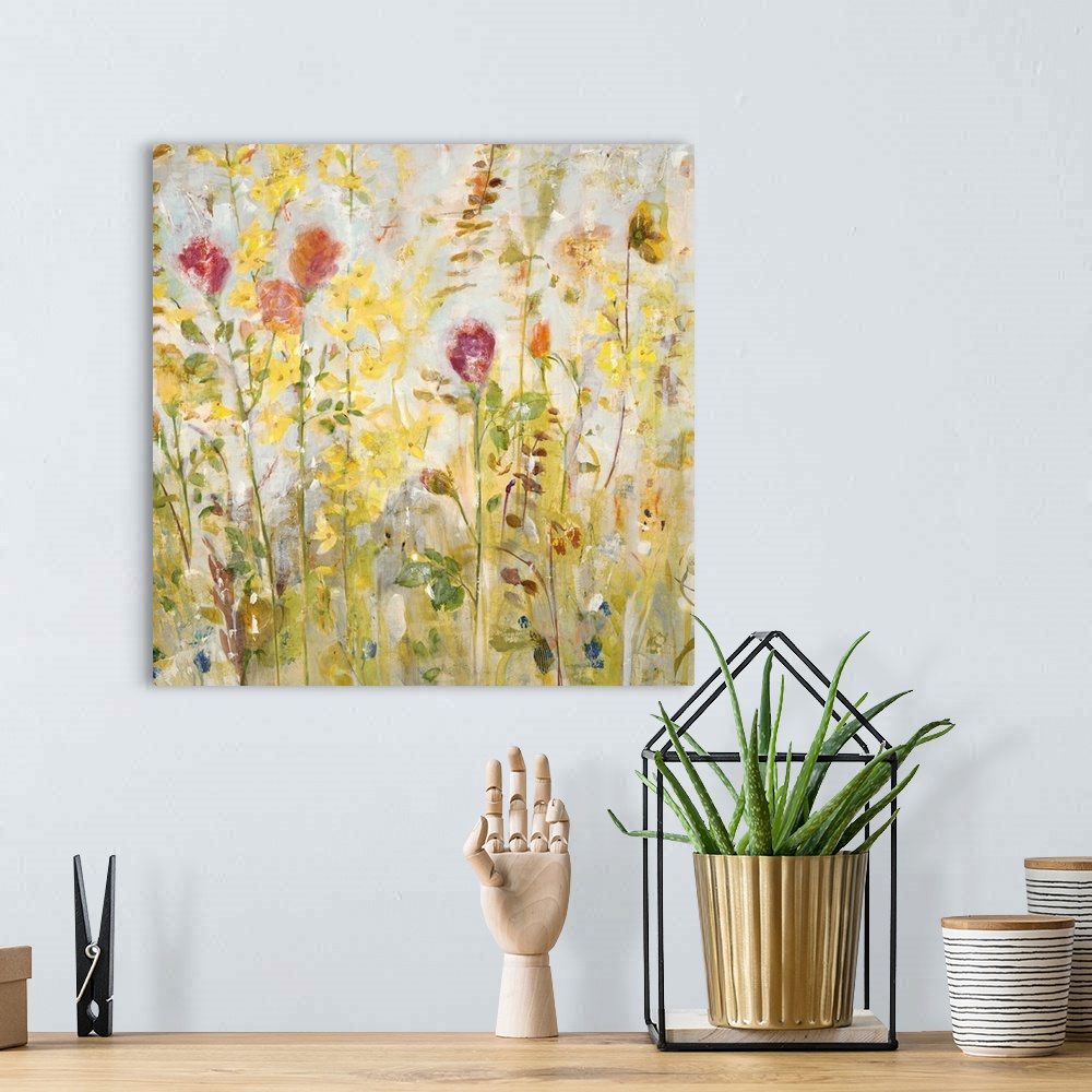 A bohemian room featuring A contemporary painting of a garden of pale red and yellow flowers.