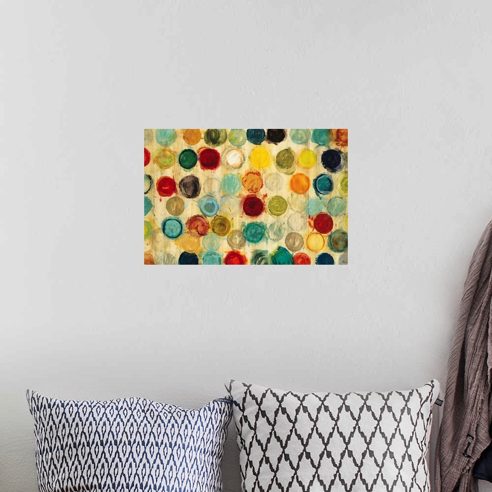 A bohemian room featuring Abstract artwork of a collection of multicolored circles, all of the same size, arranged in semi-...