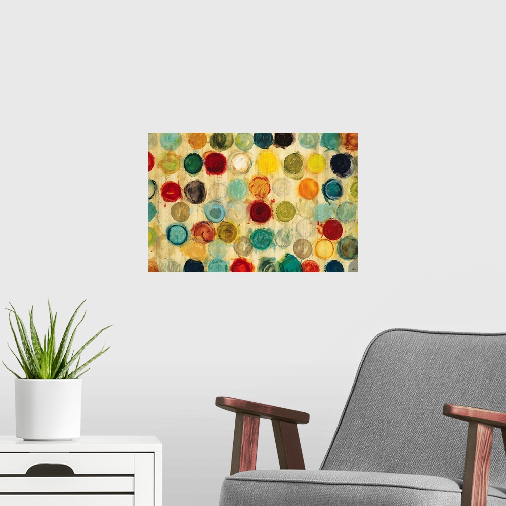 A modern room featuring Abstract artwork of a collection of multicolored circles, all of the same size, arranged in semi-...