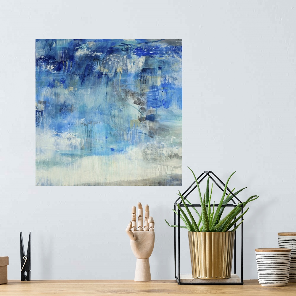 A bohemian room featuring Contemporary abstract painting using predominantly blue against neutral tones.