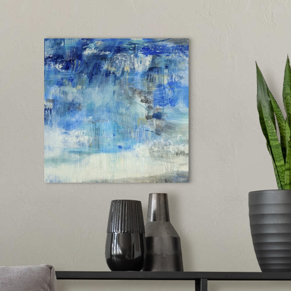 A modern room featuring Contemporary abstract painting using predominantly blue against neutral tones.