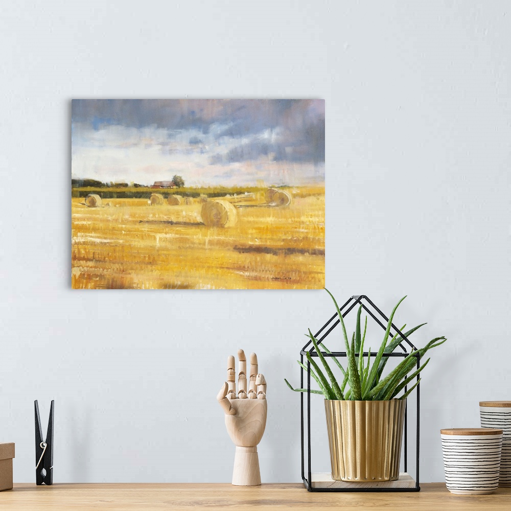 A bohemian room featuring Contemporary painting of a countryside field with golden haystacks and a small farmhouse in the b...