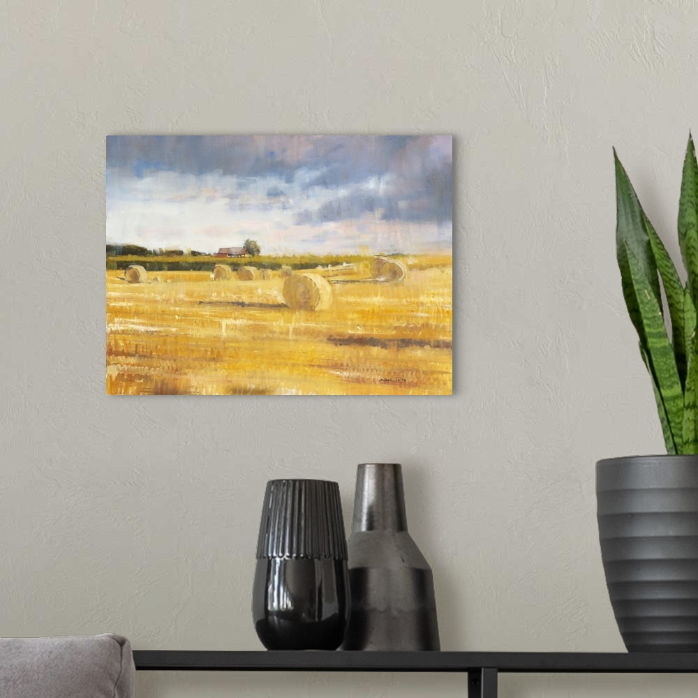 A modern room featuring Contemporary painting of a countryside field with golden haystacks and a small farmhouse in the b...