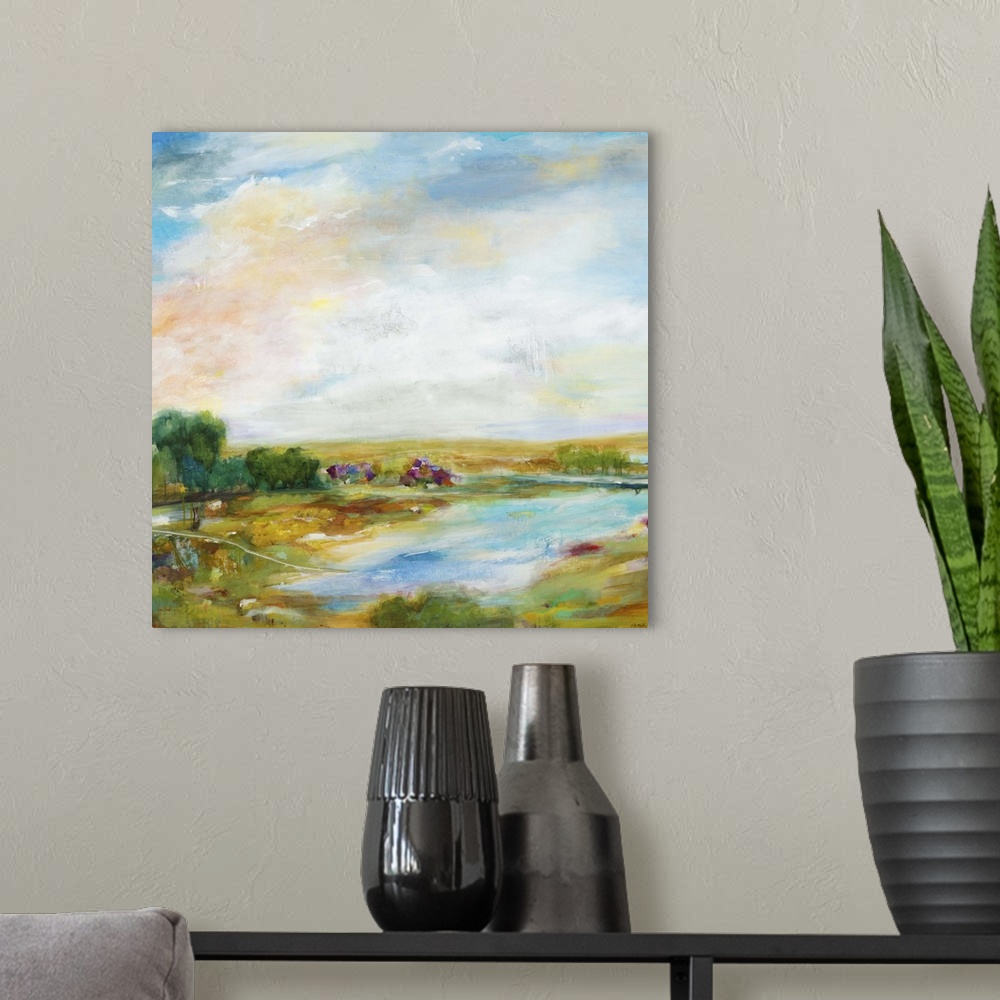 A modern room featuring Contemporary landscape painting looking out over a countryside pond.