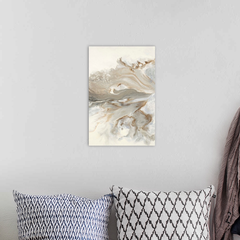 A bohemian room featuring Abstract painting with brown, gold, and gray hues marbling together on a white background.