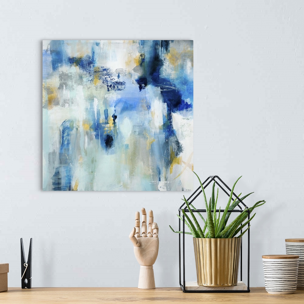 A bohemian room featuring Contemporary abstract painting using dark and light blue tones.