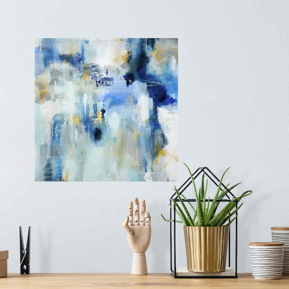 A bohemian room featuring Contemporary abstract painting using dark and light blue tones.