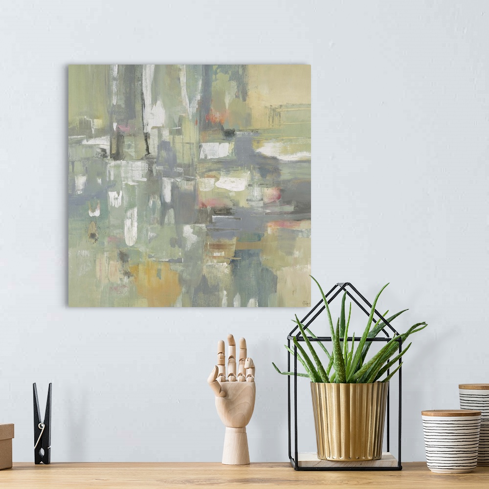 A bohemian room featuring Contemporary abstract painting of pale muted green geometric shapes colliding together.