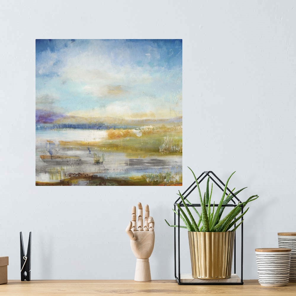A bohemian room featuring Contemporary landscape painting looking out over wetlands under a vibrant blue sky.