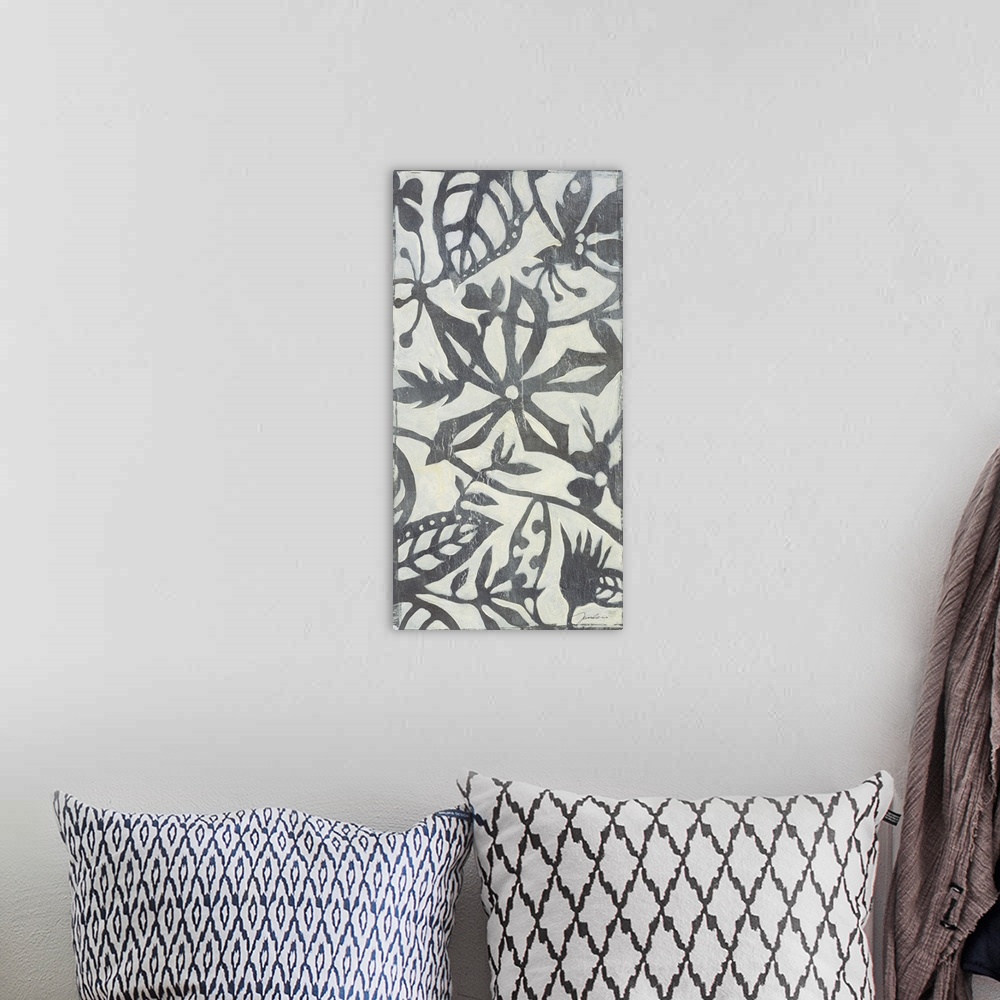 A bohemian room featuring A long vertical design of a metallic silver and white floral pattern.