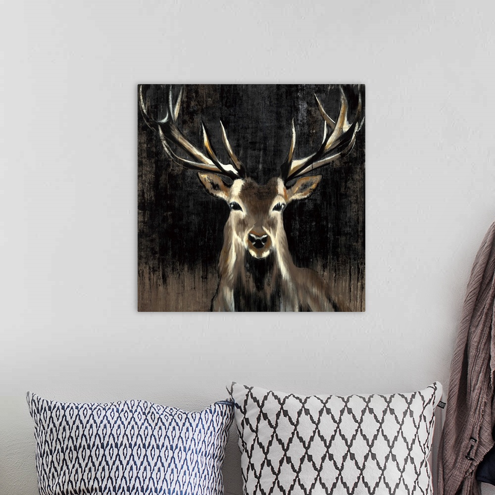 A bohemian room featuring Contemporary painting of a stag against a dark background.