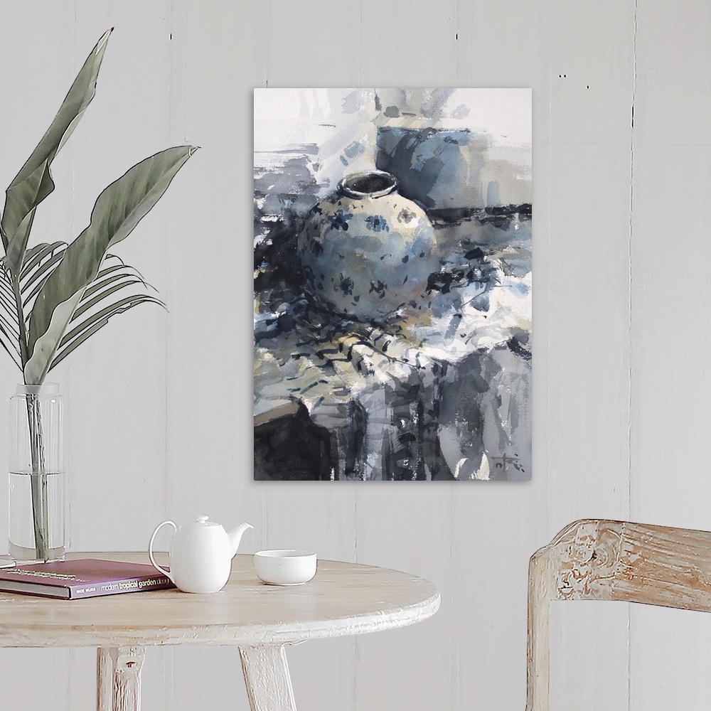 A farmhouse room featuring A monochromatic blue vase sits restfully on a table in this contemporary artwork.