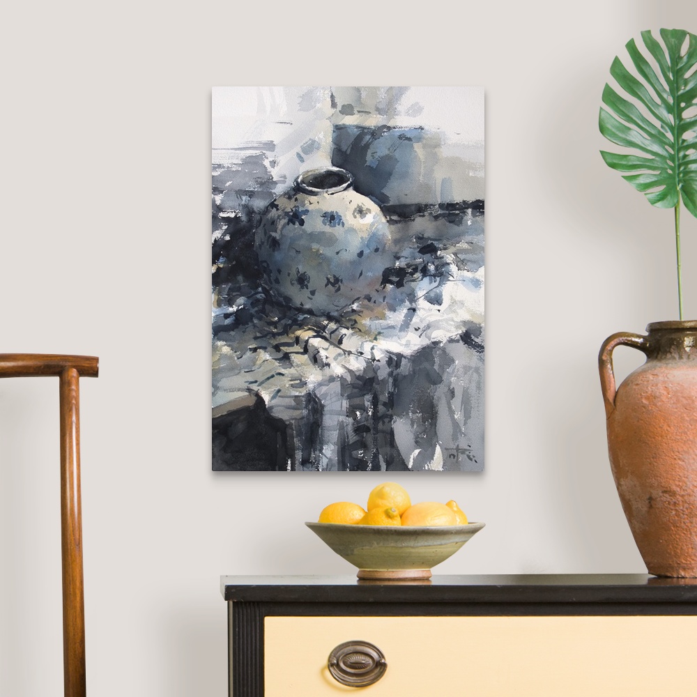 A traditional room featuring A monochromatic blue vase sits restfully on a table in this contemporary artwork.