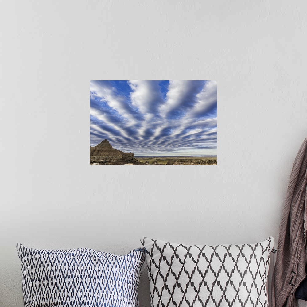 A bohemian room featuring Interesting cloud pattern in the sky over Badlands National Park, South Dakota.