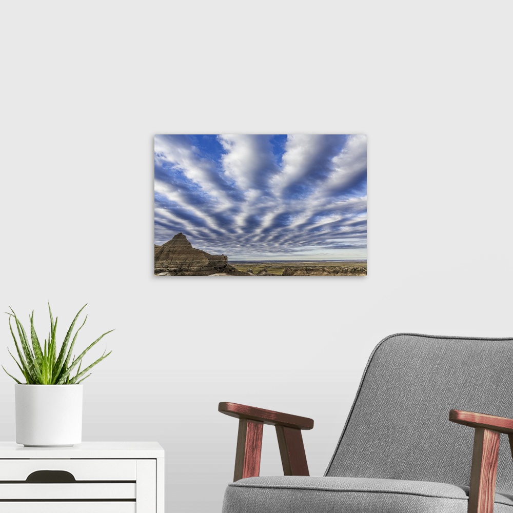 A modern room featuring Interesting cloud pattern in the sky over Badlands National Park, South Dakota.