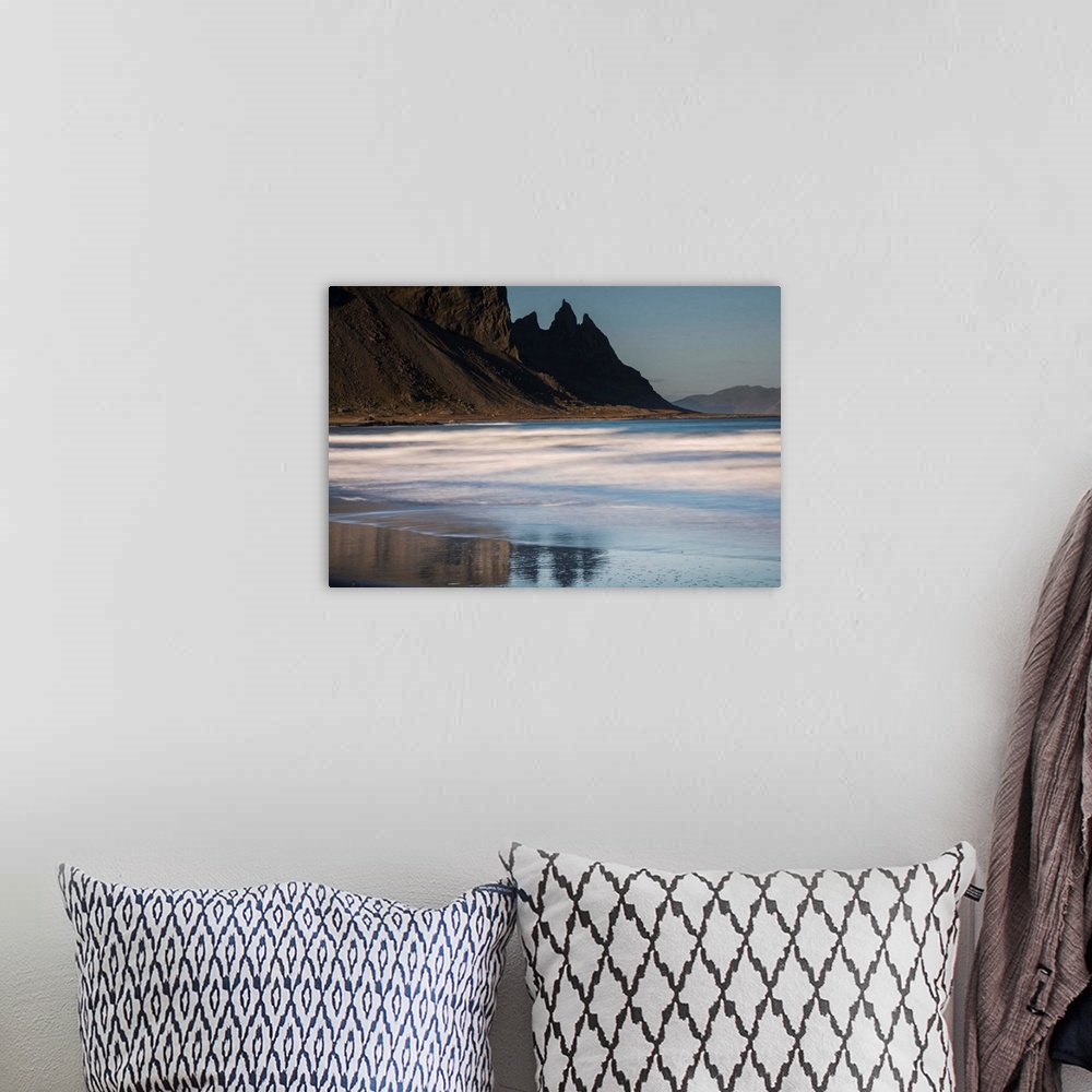A bohemian room featuring Rocky cliffs surrounding the beach in Iceland.