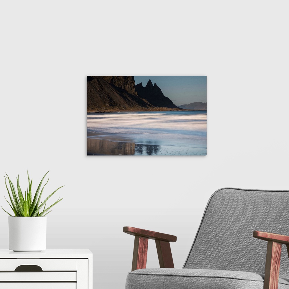 A modern room featuring Rocky cliffs surrounding the beach in Iceland.
