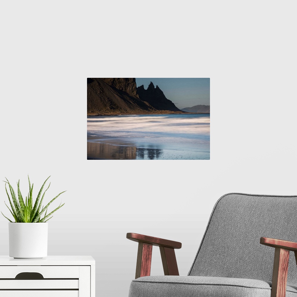 A modern room featuring Rocky cliffs surrounding the beach in Iceland.