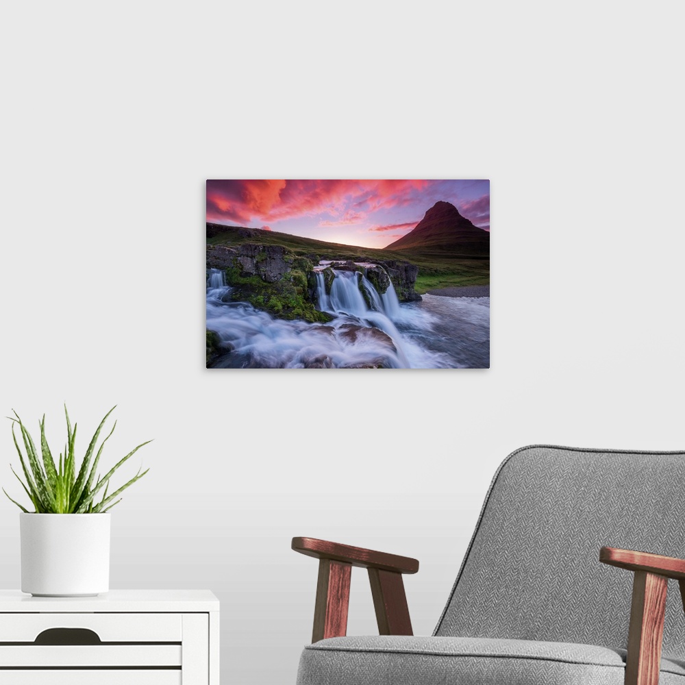 A modern room featuring Vivid light on clouds at dusk over a waterfall near Kirkjufell, Iceland.