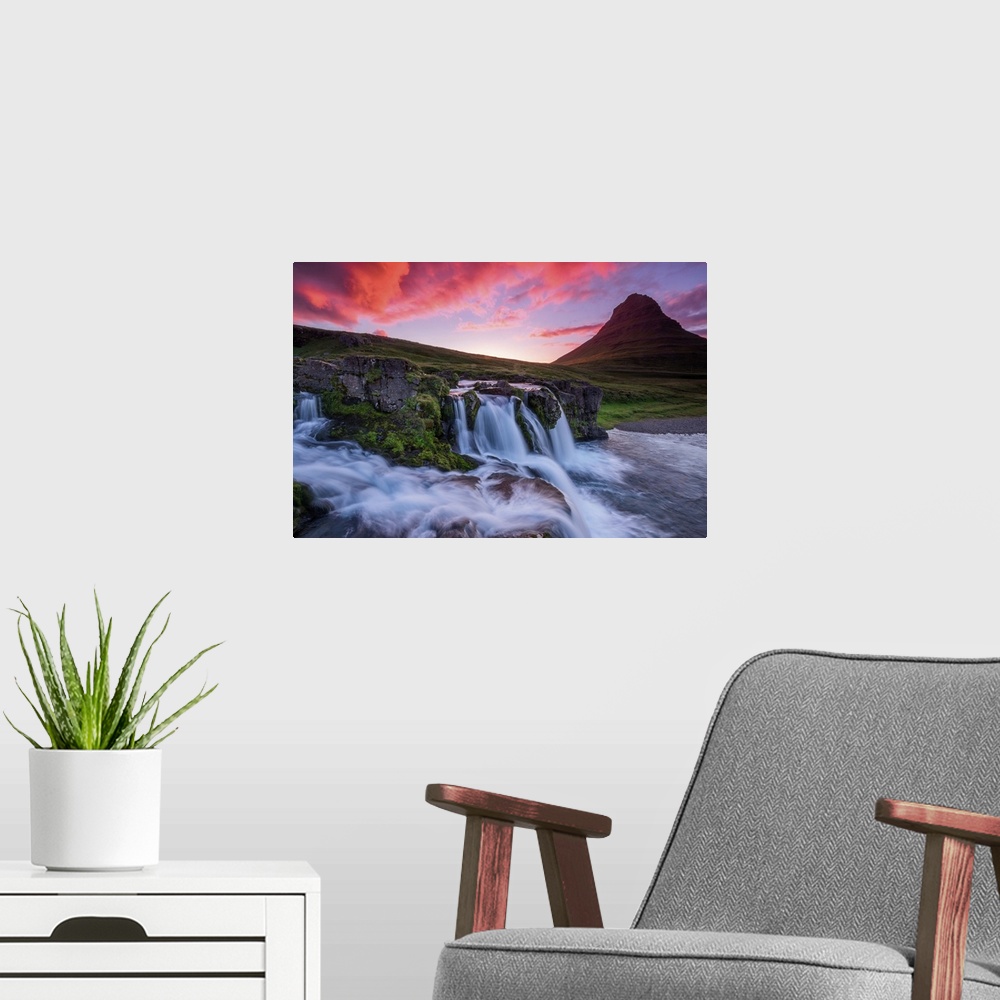 A modern room featuring Vivid light on clouds at dusk over a waterfall near Kirkjufell, Iceland.