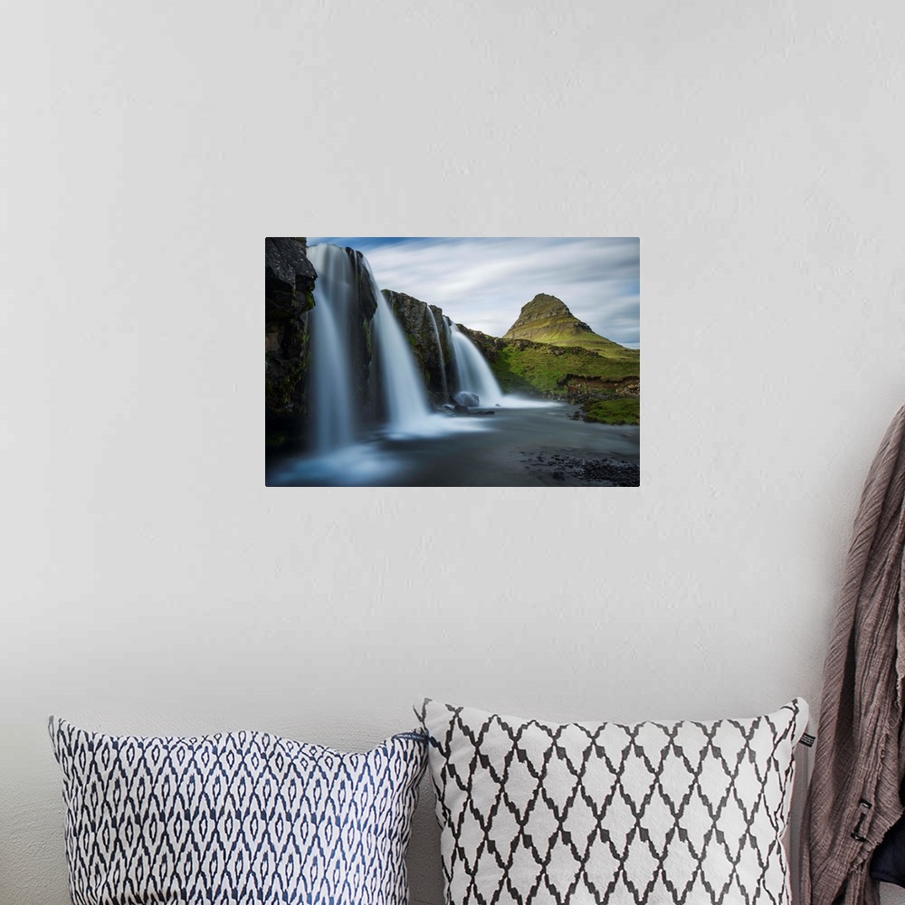 A bohemian room featuring Glacial waterfall in Iceland with a view of Kirkjufell mountain in the distance.