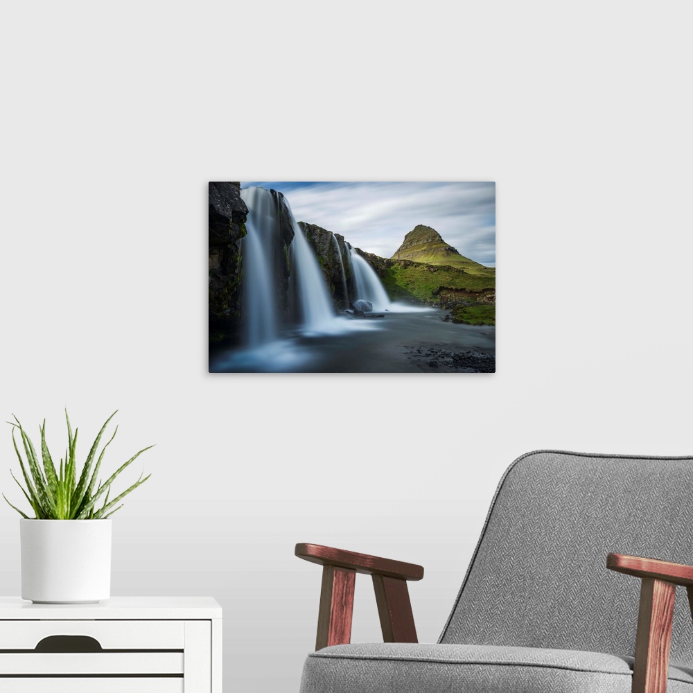 A modern room featuring Glacial waterfall in Iceland with a view of Kirkjufell mountain in the distance.