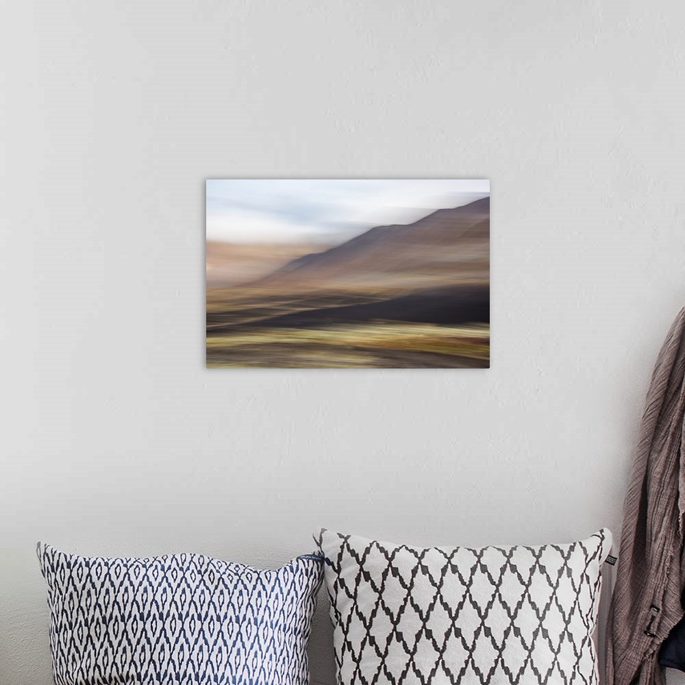 A bohemian room featuring Blurred image of a mountain landscape, with an ethereal feeling.