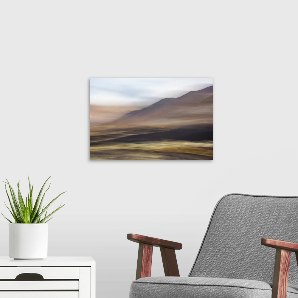 A modern room featuring Blurred image of a mountain landscape, with an ethereal feeling.