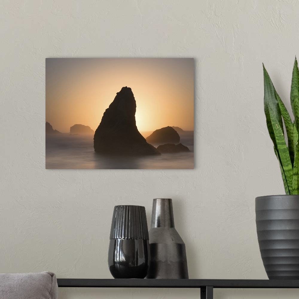 A modern room featuring Pointed sea stack in the misty ocean in the morning, Bandon, Oregon.