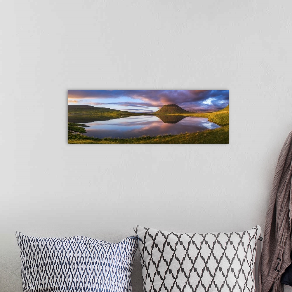 A bohemian room featuring Panoramic view of Mount Kirkjufell and the lake below at sunset, Iceland.