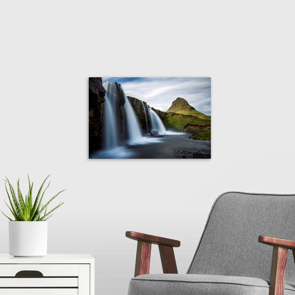 A modern room featuring Waterfalls in Iceland with verdant Mount Kirkjufell in the distance.