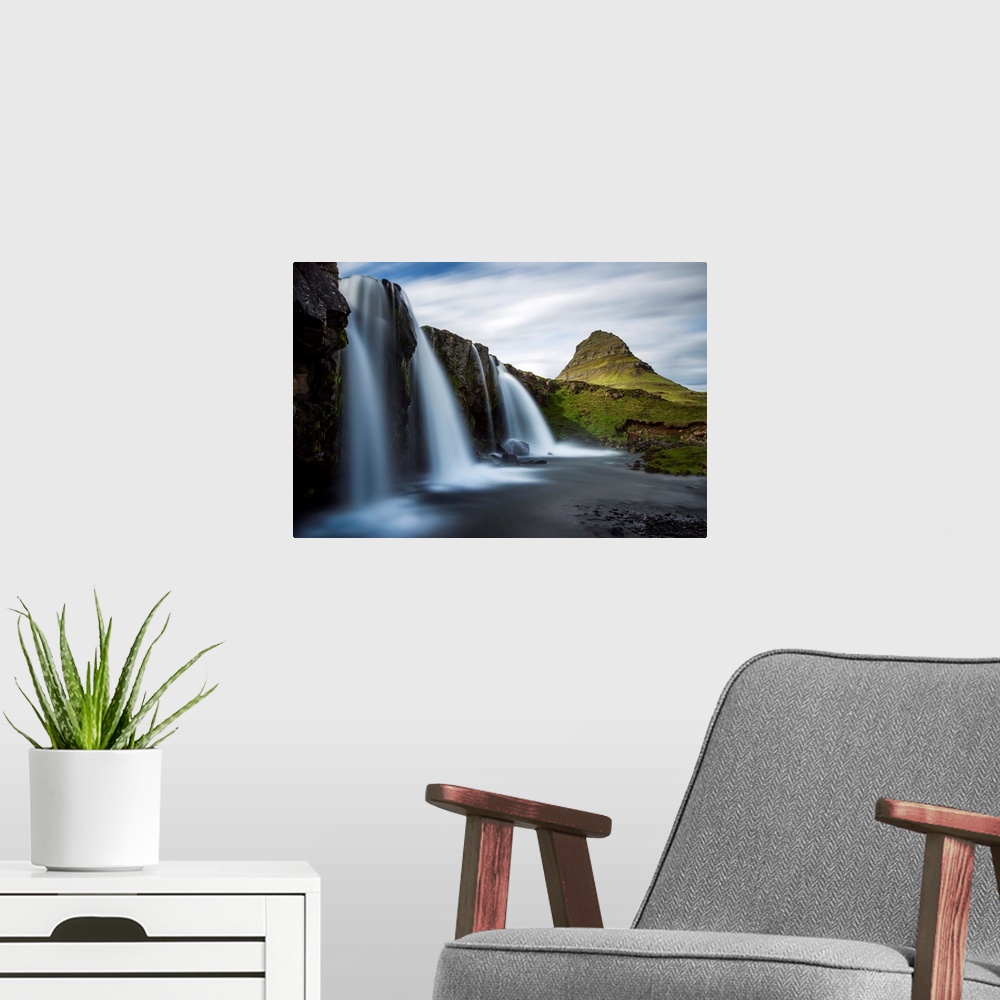A modern room featuring Waterfalls in Iceland with verdant Mount Kirkjufell in the distance.