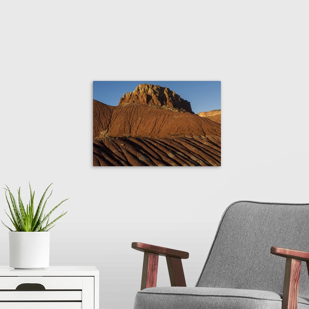 A modern room featuring Tall desert rocks just outside of Santa Fe, New Mexico, in the late afternoon.