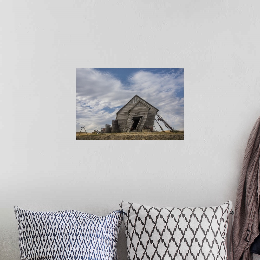 A bohemian room featuring Abandoned schoolhouse building leaning heavily to the side, against a backdrop of clouds, Palouse...