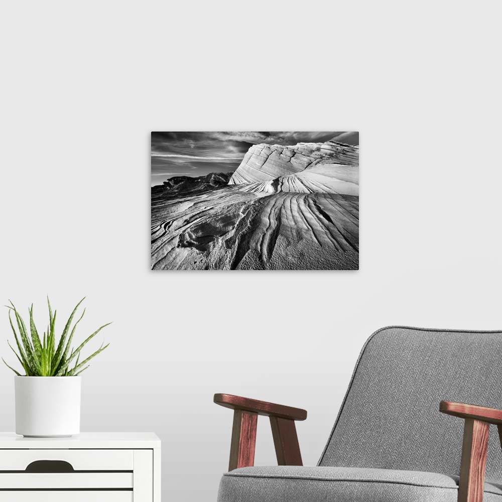 A modern room featuring Striated rock formations in the desert near Page, Arizona, in black and white.