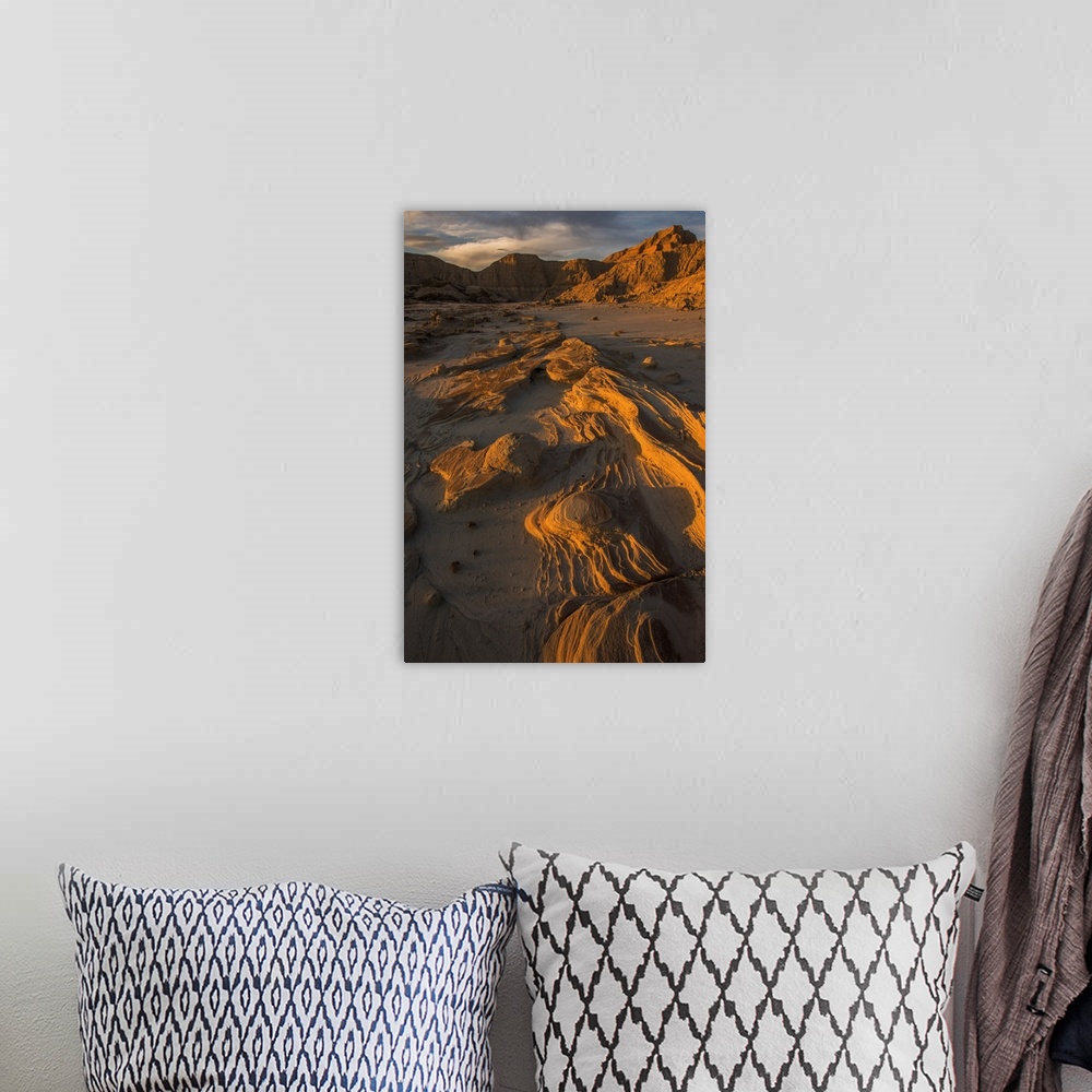 A bohemian room featuring Eroded rocks in the South Dakota Badlands in warm light from the sunset.