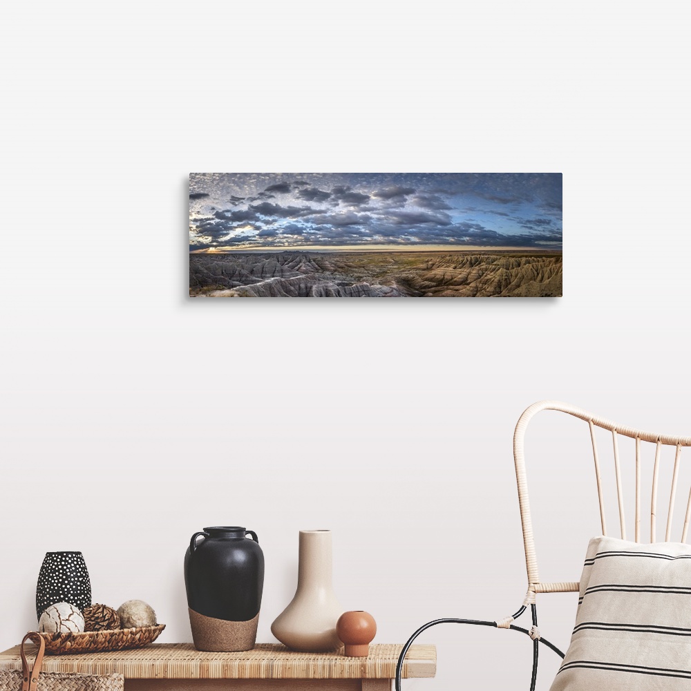 A farmhouse room featuring Panoramic view of stunning clouds at sunset over the hilly terrain of the South Dakota Badlands.
