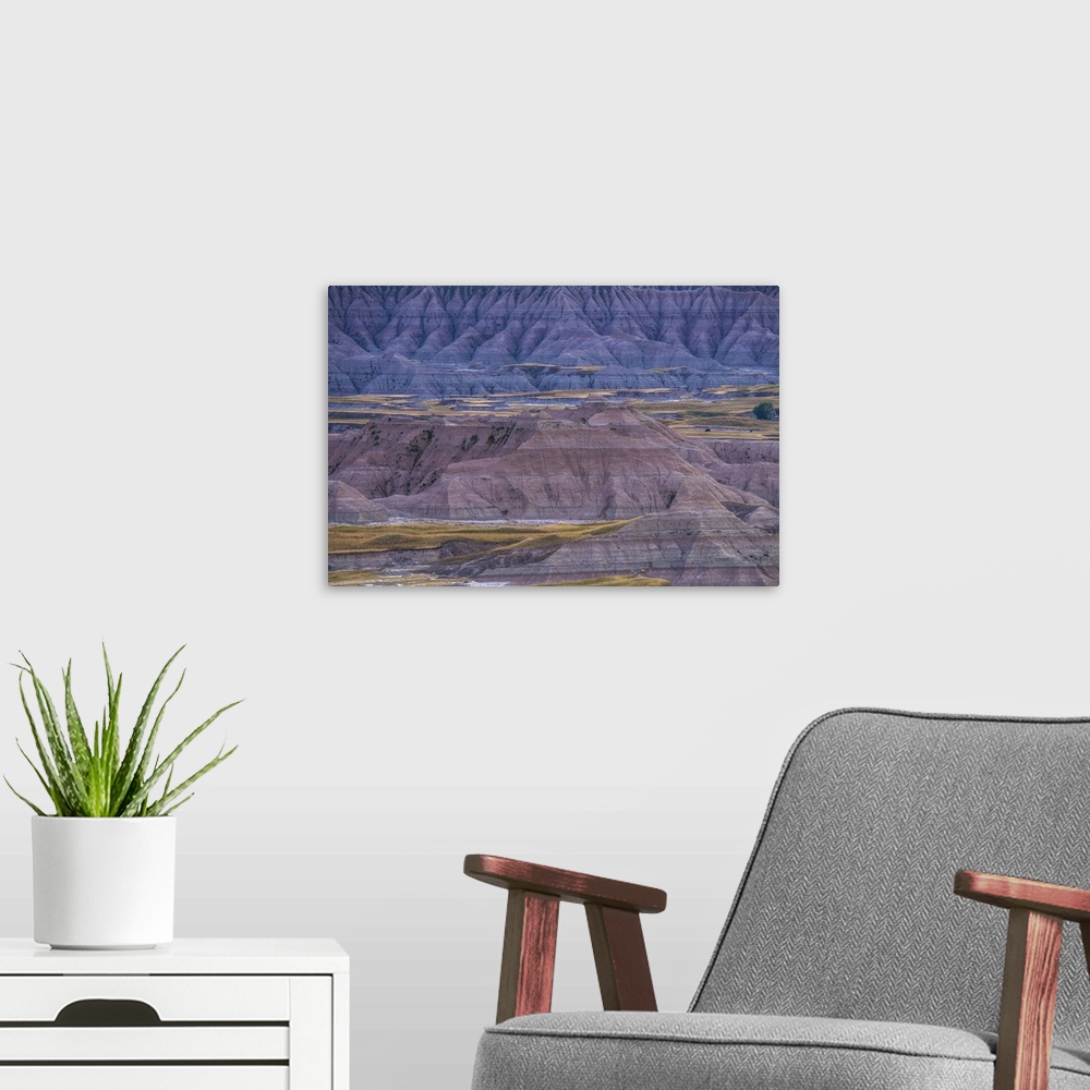 A modern room featuring Sedimentary rock layers visible in the eroded landscape of Badlands National Park, South Dakota.