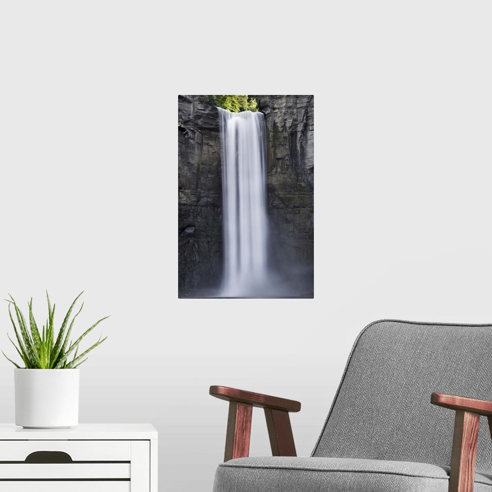 A modern room featuring Tall waterfall on a stone cliff in Ithaca, New York.