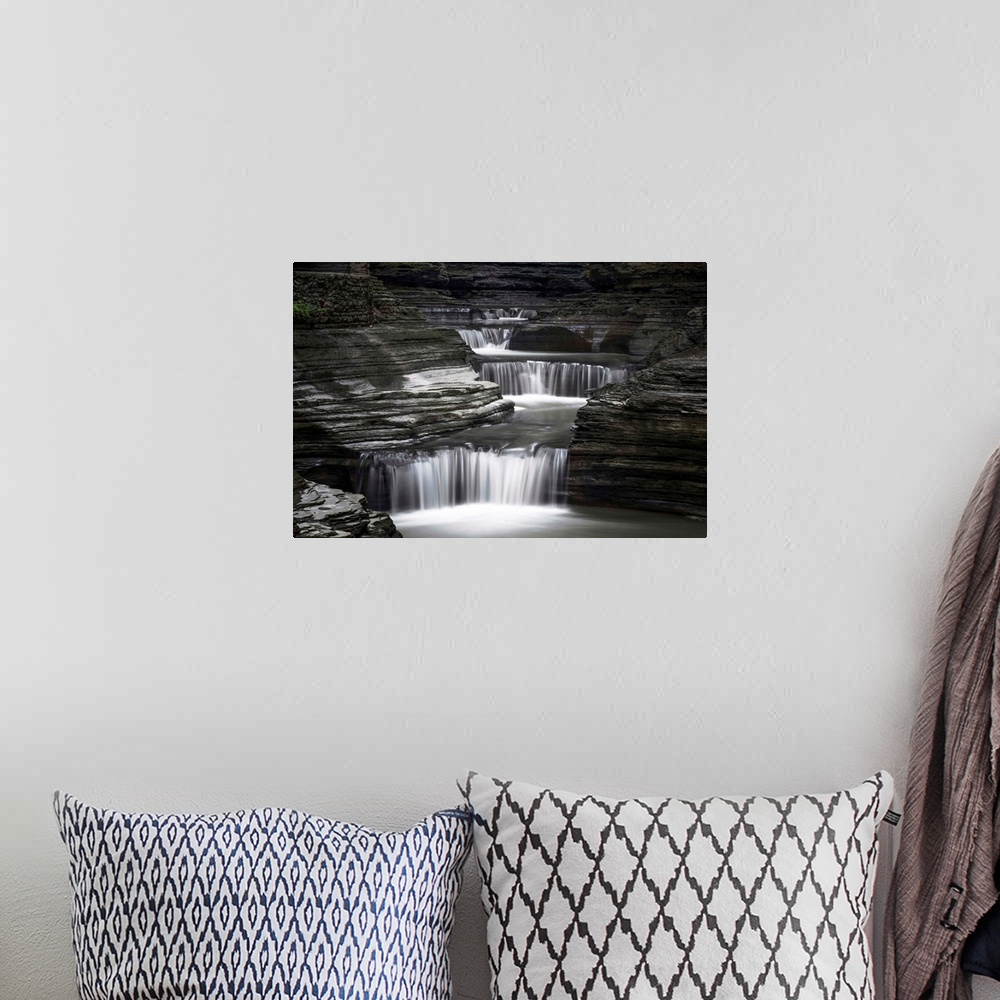 A bohemian room featuring Black and white image of a rushing waterfall in upstate New York.