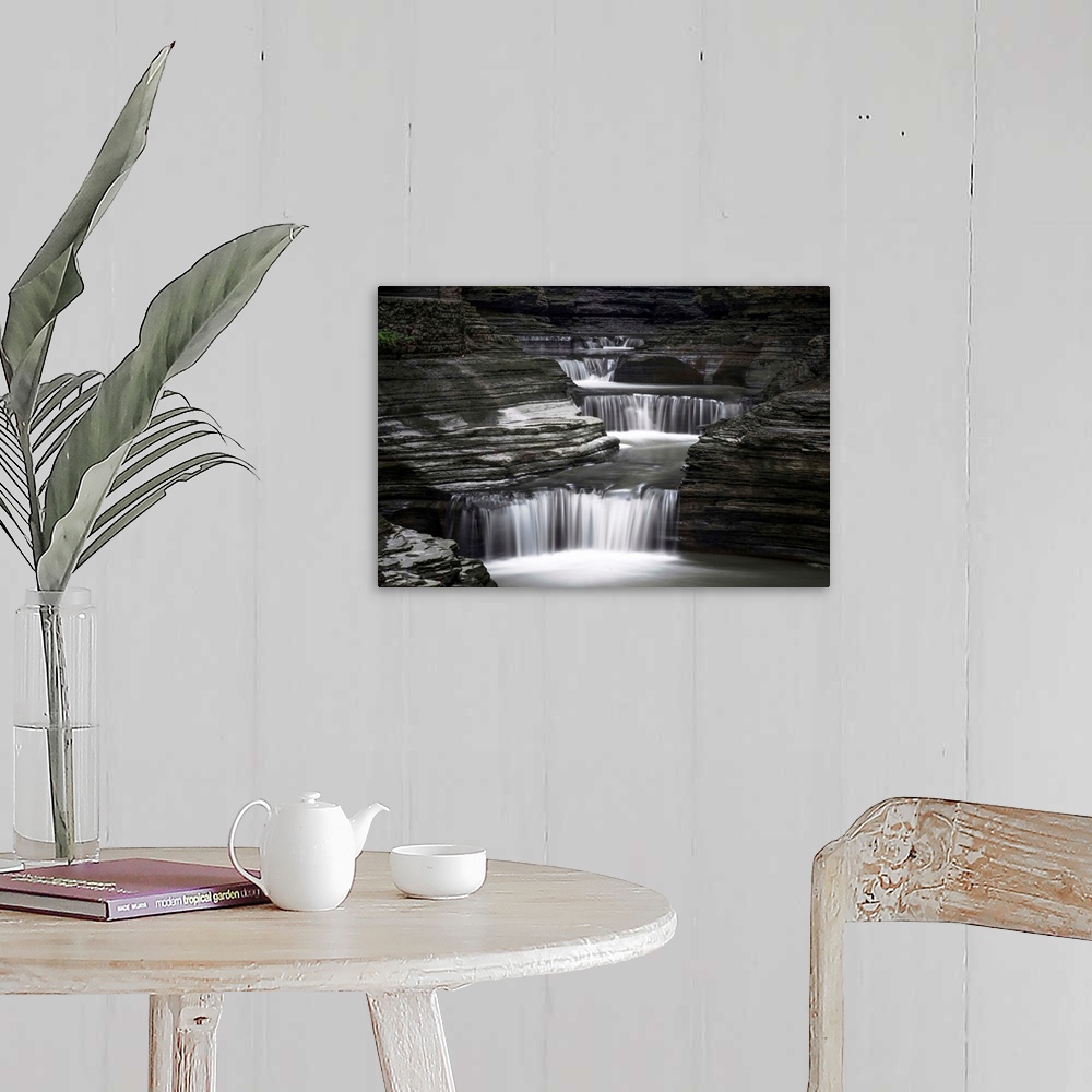 A farmhouse room featuring Black and white image of a rushing waterfall in upstate New York.