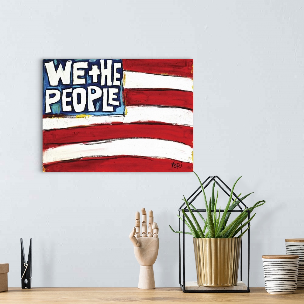 A bohemian room featuring We The People Flag
