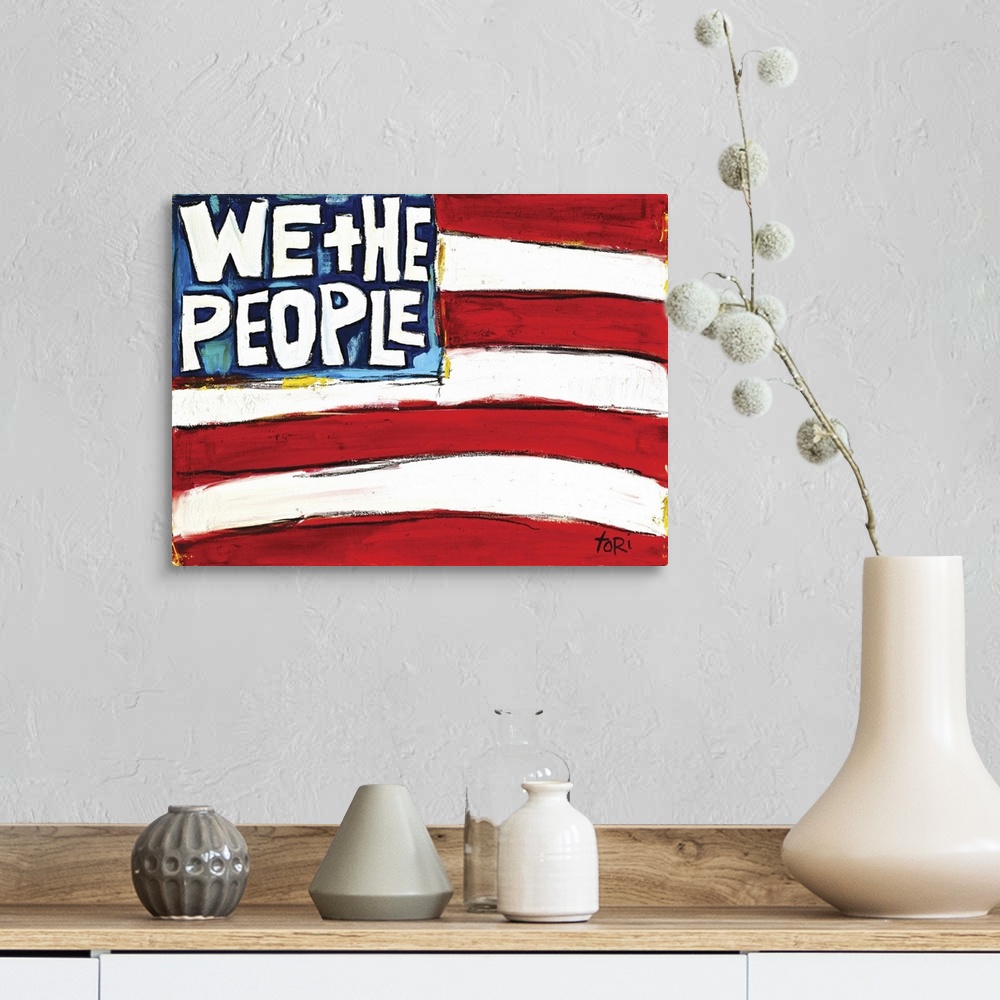A farmhouse room featuring We The People Flag
