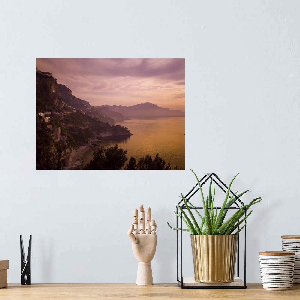 A bohemian room featuring A beautiful sunset turns this view of the Amalfi Coast purple and orange