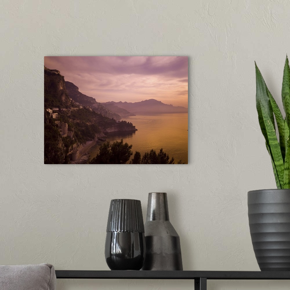 A modern room featuring A beautiful sunset turns this view of the Amalfi Coast purple and orange