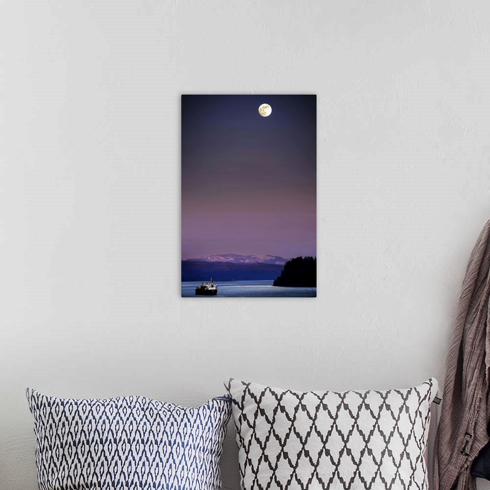 A bohemian room featuring A full moon at night above snow capped mountains and a ship