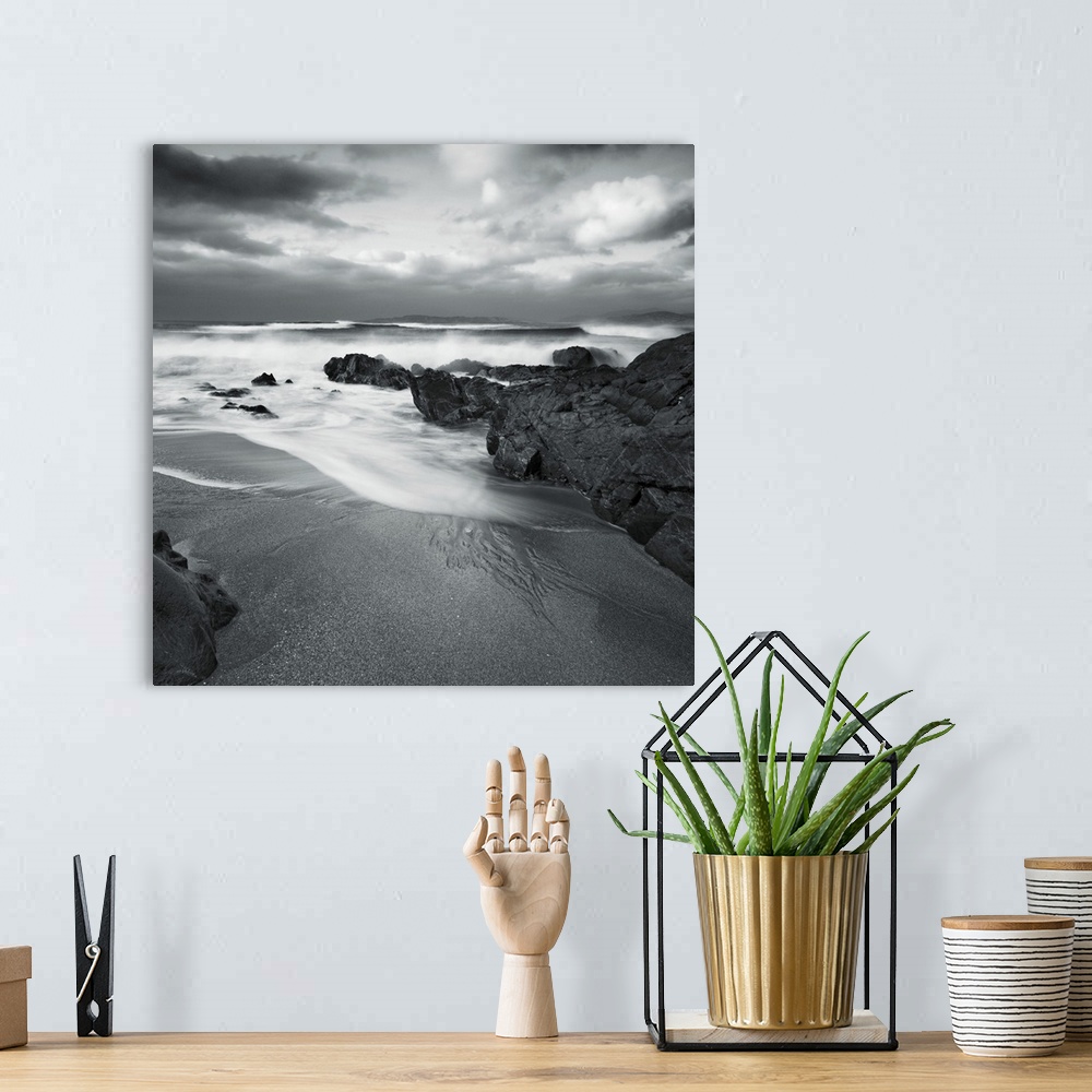 A bohemian room featuring A peaceful cove with sand and surf