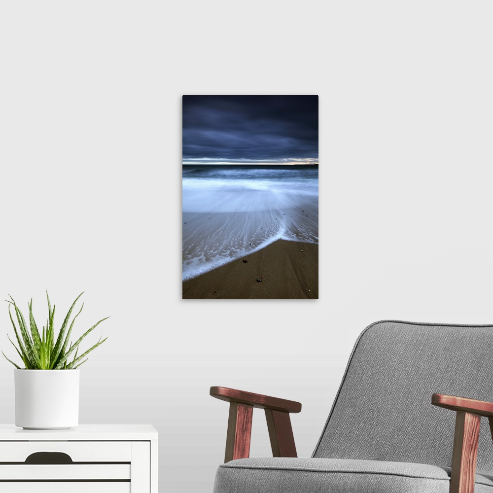 A modern room featuring Southbourne beach at sunset.