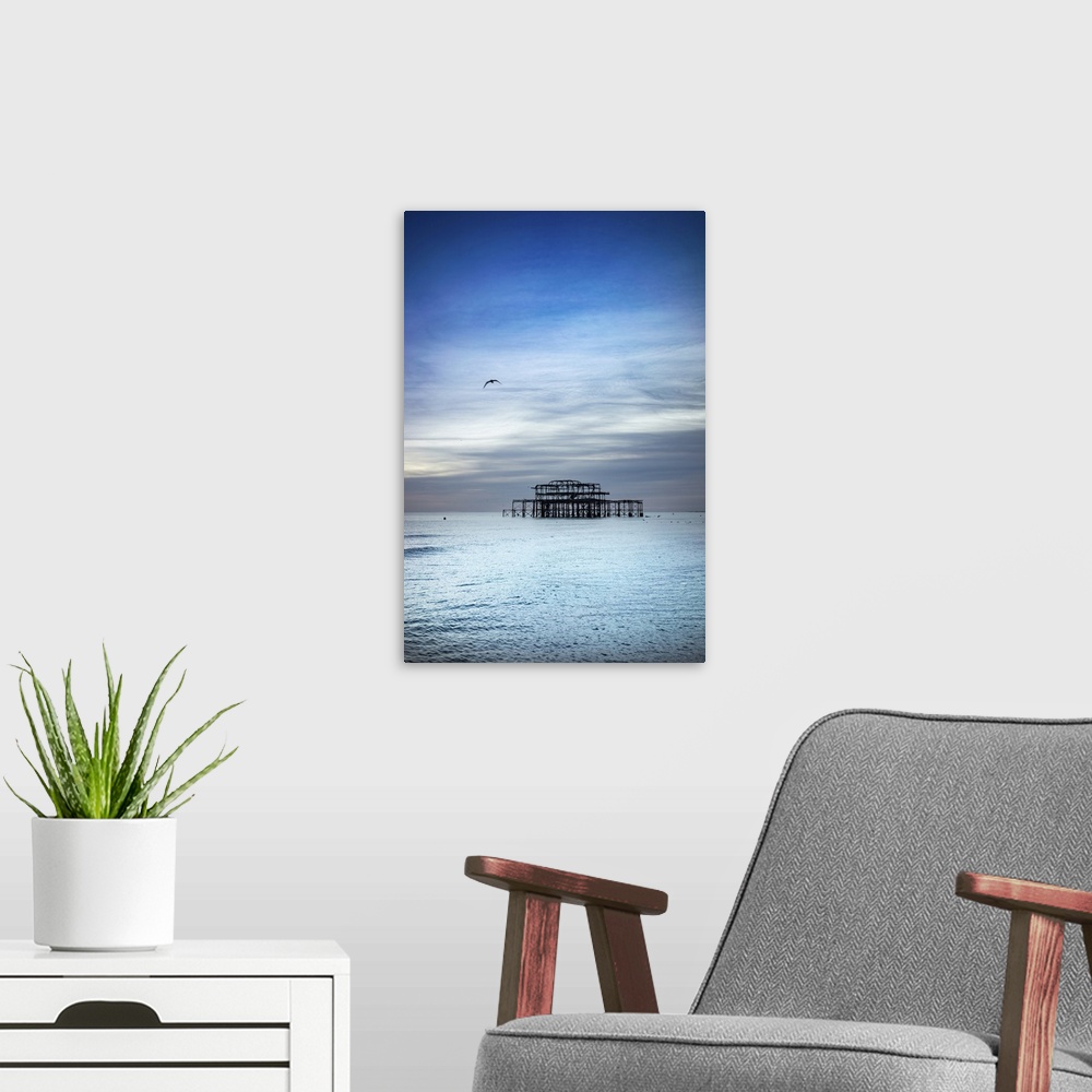 A modern room featuring Brighton is a seaside town in the south of England, UK. Dusk on the beach. The West Pier is a pie...