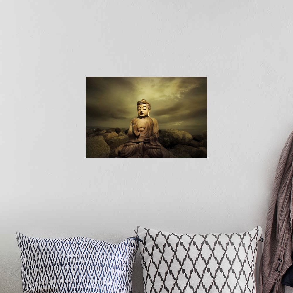 A bohemian room featuring A bhudda on a rocky shore